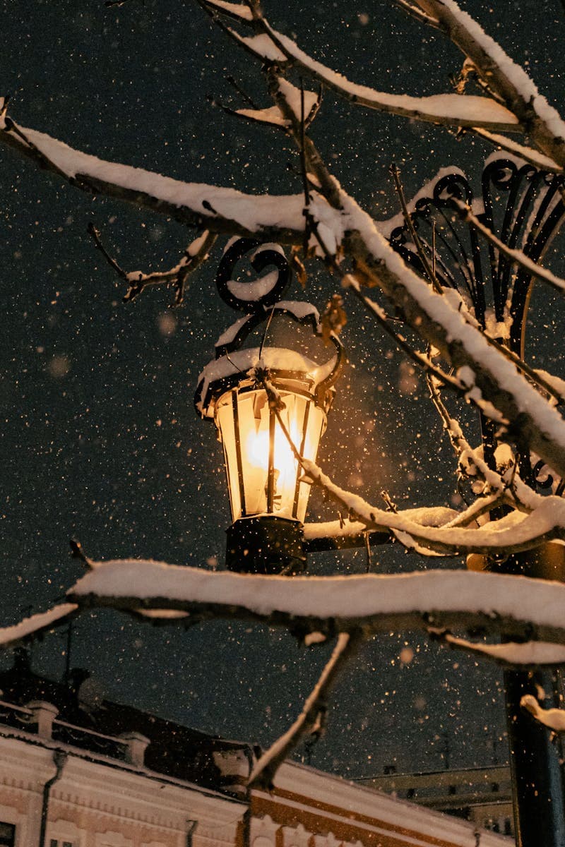 Snowy European street lamp